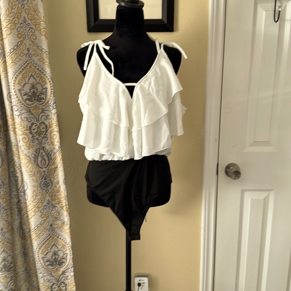 White body suit tank top with ruffled neckline